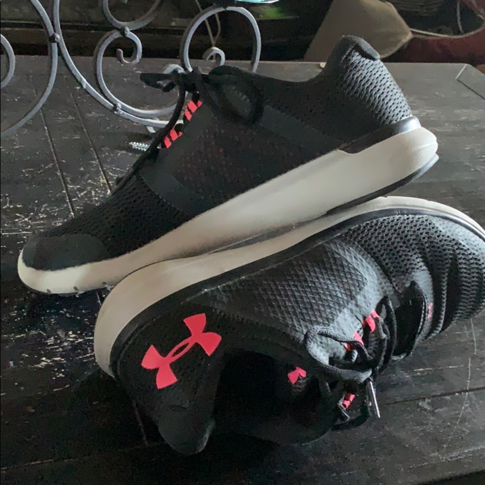 Black and pink Under Armour shoes